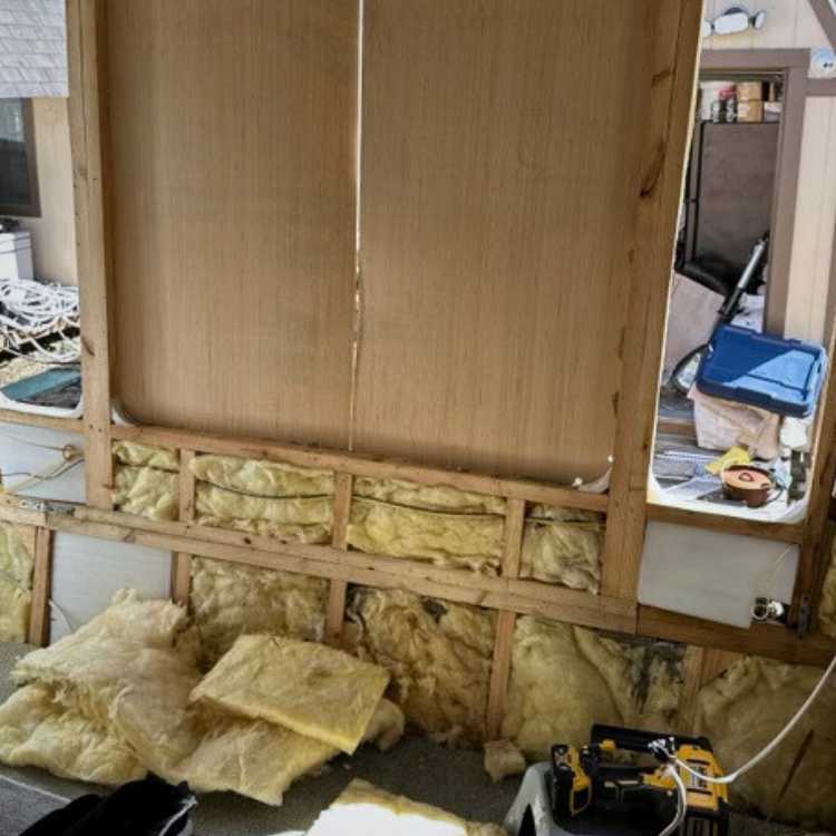Image of exterior and interior wall replacement on travel trailer.